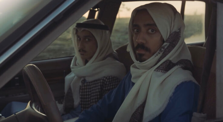 Two young men look shoked in a car from the movie Arabian Alien