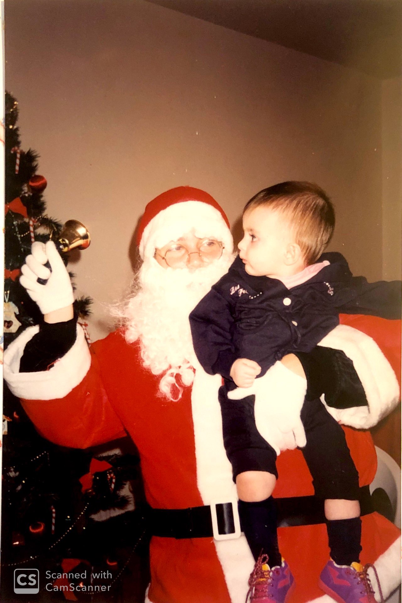 Santa Claus holding a baby