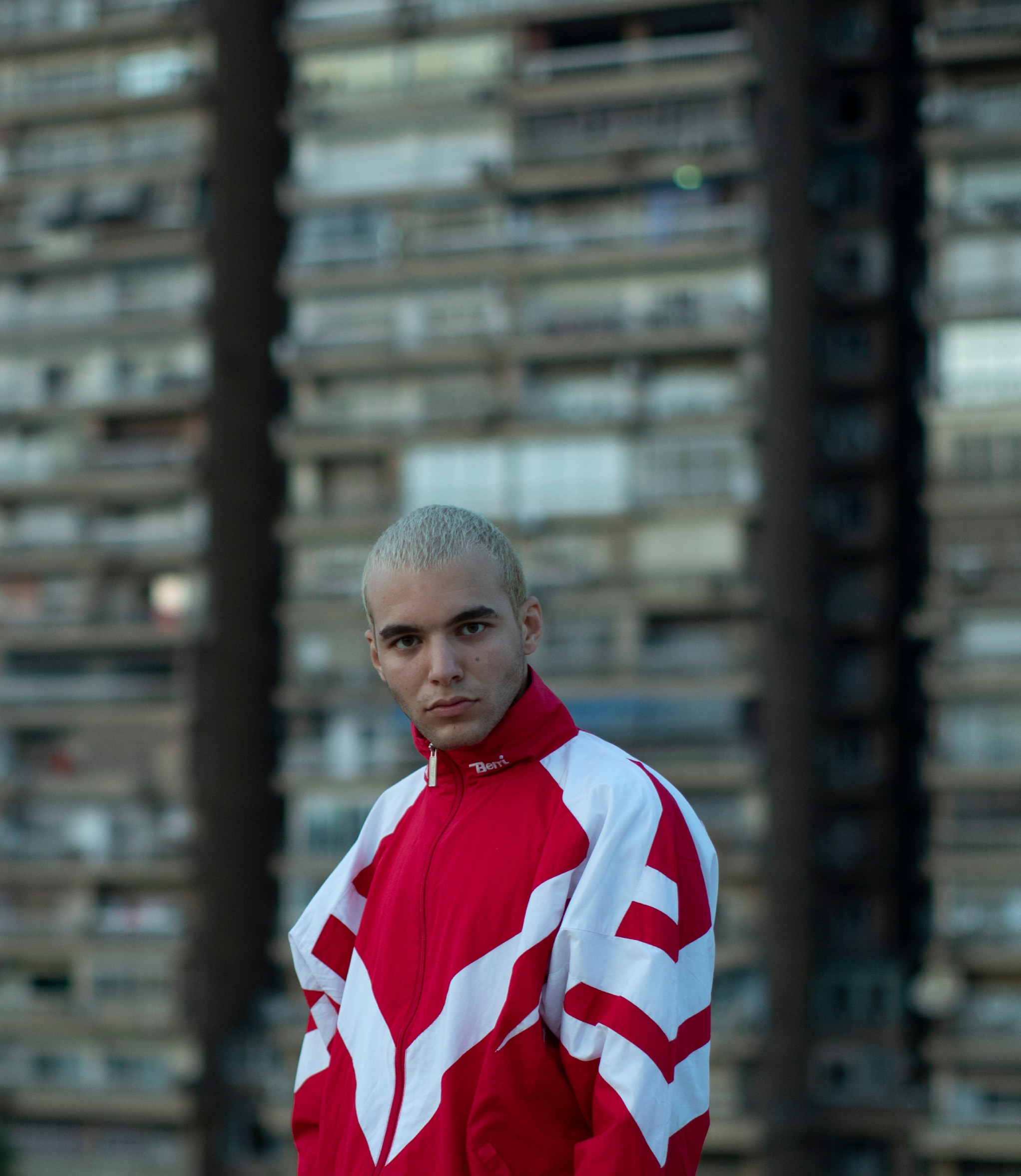 Young man in red tracksuit by Youssef Sherif