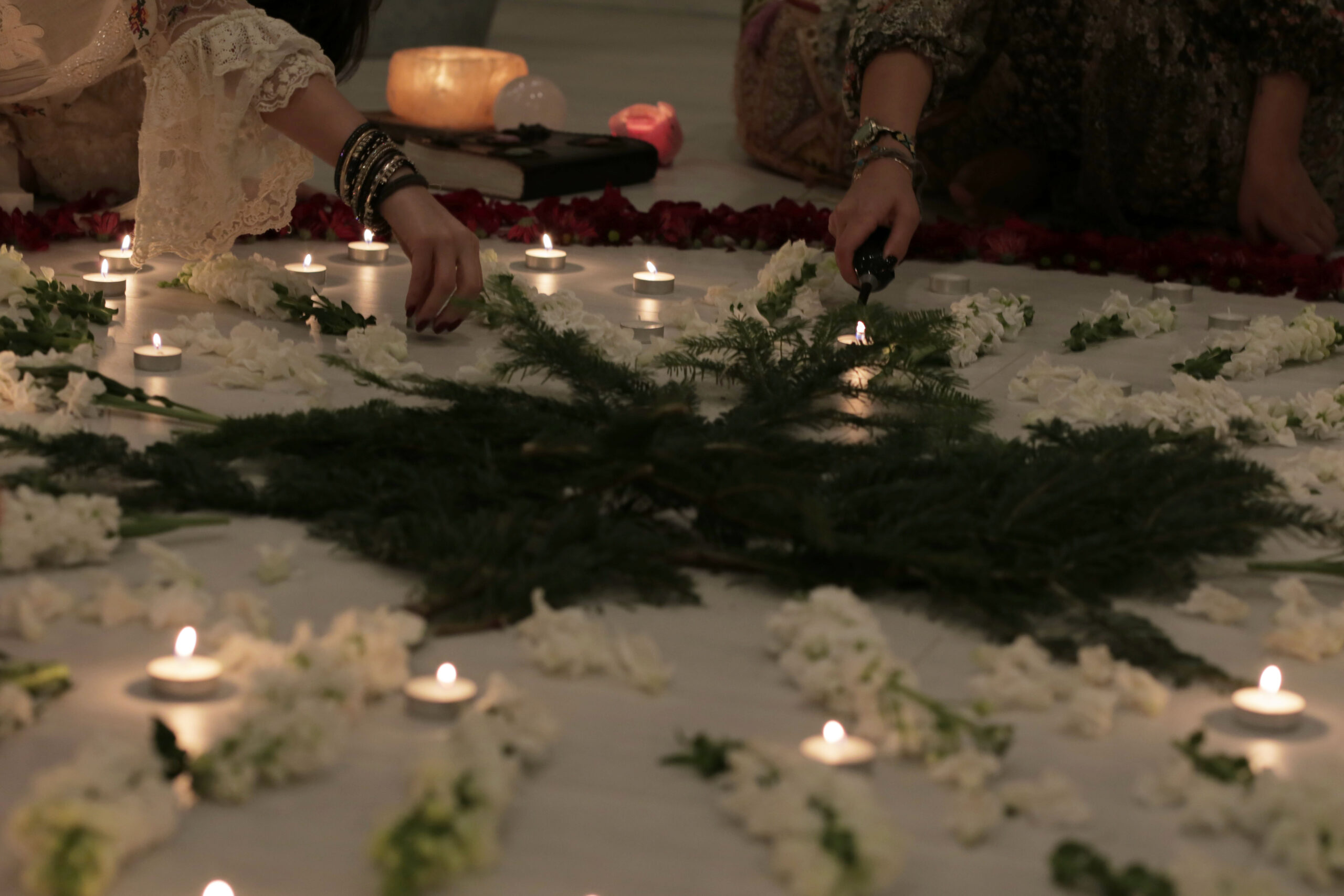 lit candles in a meditation gathering