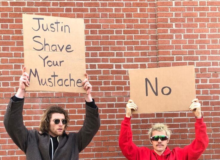 Justin Bieber and the dude with sign