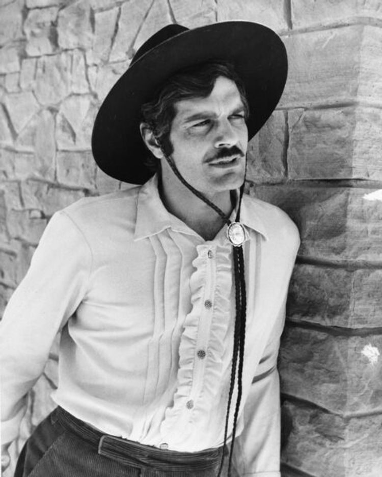 Omar Sharif in a chic cowbot look