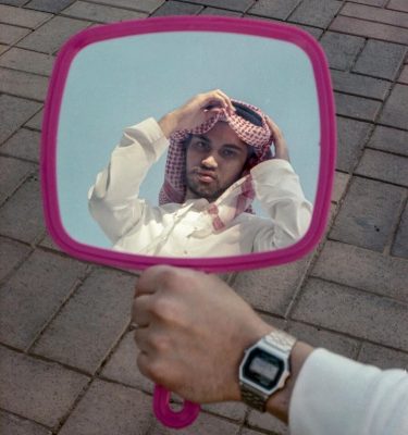 Khaliji guy seeing himself in the mirror