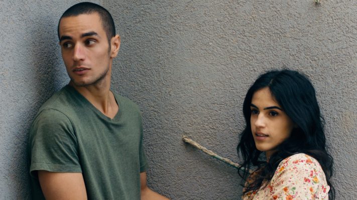 Omar (Adam Bakri) is a Palestinian baker and secret informant who braves the wall that splits his community to visit his lover, Nadia (Leem Lubany) in the Oscar-nominated film